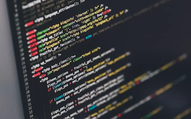 A developer working through code on a screen.